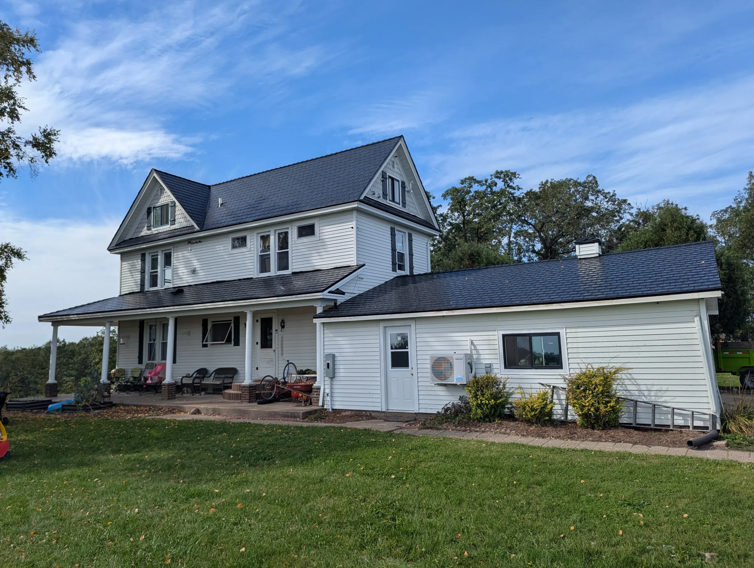 Beautiful white house with new asphalt roof